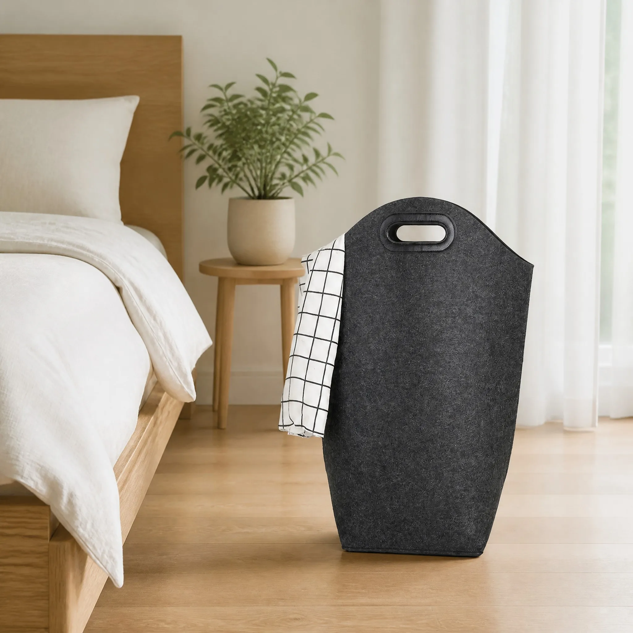 Felt laundry hamper in a warm bedroom setting