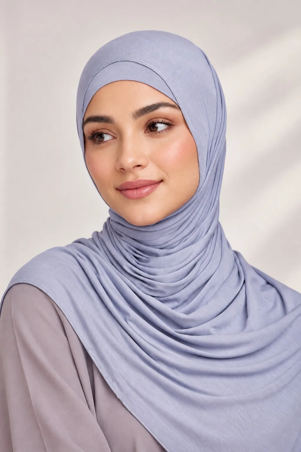 Custom matching bamboo jersey hijab set periwinkle blue — single model side drape view