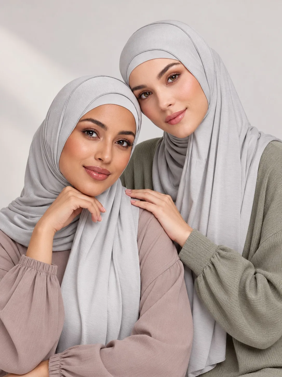 Custom matching bamboo jersey hijab set — single model seated showing full drape in pearl grey