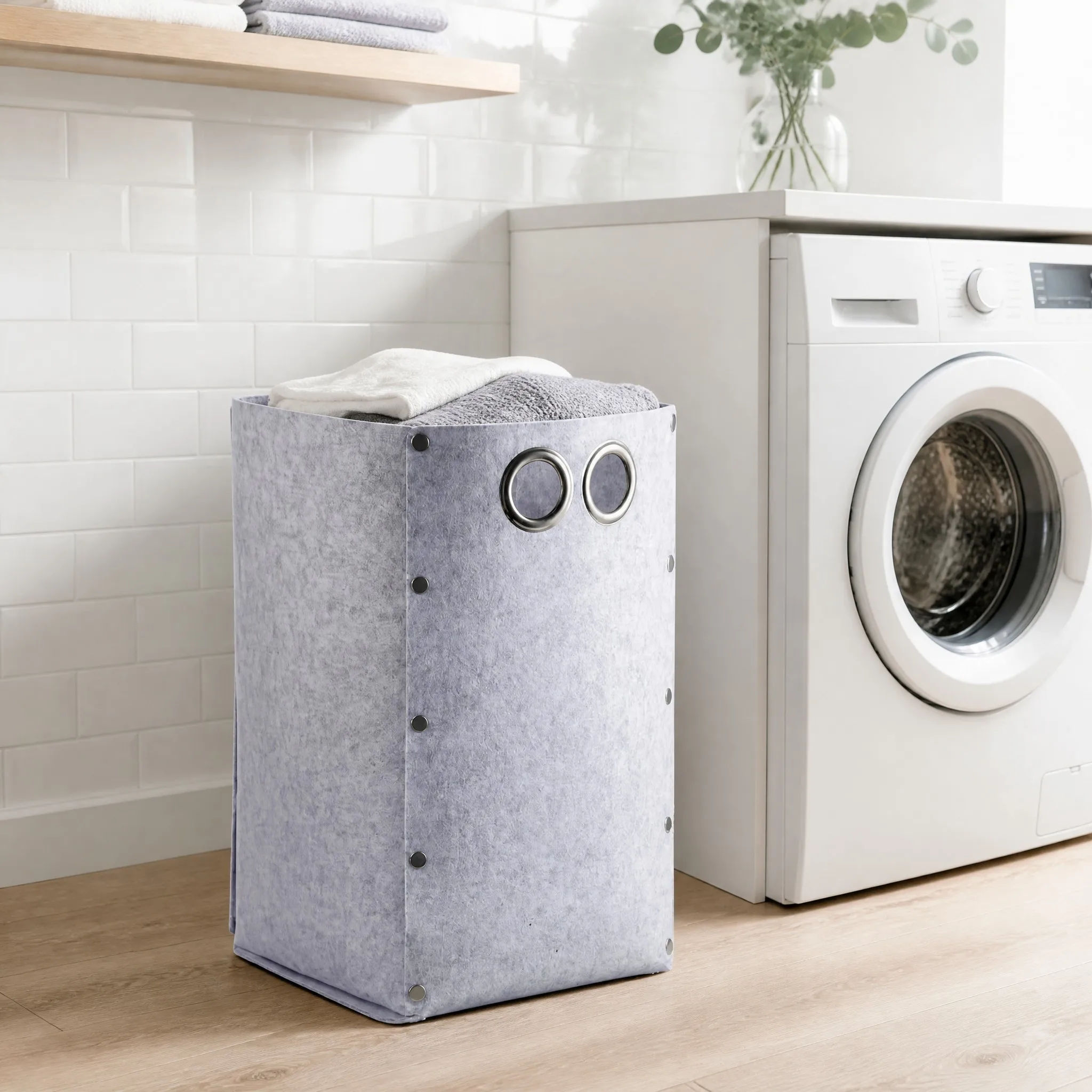 Foldable flat-pack felt storage basket shown from a second angle