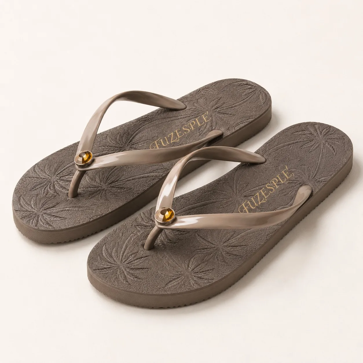 Angled view brown palm tree gem flip flops