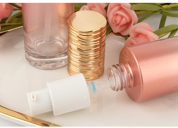 50ml high end thick bottom skincare packaging set pink cylinder glass pump bottle cosmetic face cream jar manufacture