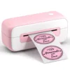 เครื่องพิมพ์สีชมพูและขาว พร้อมกระดาษสติกเกอร์ขนาด 4x6 นิ้ว 10 แผ่น