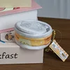 Yellow cat food cans are about 7cm in diameter