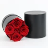 4 rose In scatola rotonda