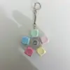 Round cap colorful rotating button keychain
