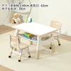 Whiteboard, wooden table and two chairs