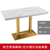 Table longue en placage de faux marbre blanc