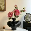 Black vase with shoulder design (unfurled)
