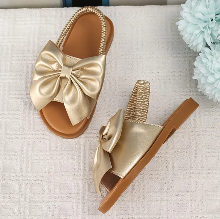 BSCI/Smeta/Sedex/Higg/GRS Factory Wholesale Custom Logo Baby Girl Gold Bowknot Sandals Elastic Webbing Princess Slipper Sandal