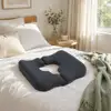 Buttock sore pad-black cover-white pillow insert