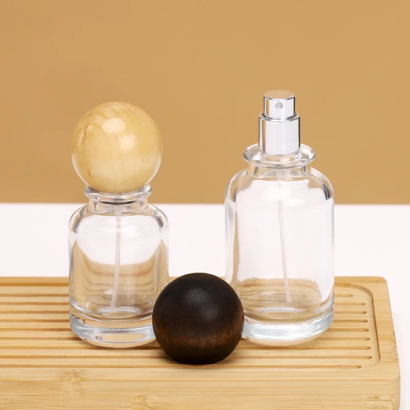 Custom Unique Round 30ml 50ml 100ml Clear Luxury Empty Glass Spray Perfume Bottles Packaging Glass Bottle With Ball Cap