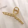 8 twist cross-matte gold