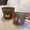 One small tulip bow woven storage basket