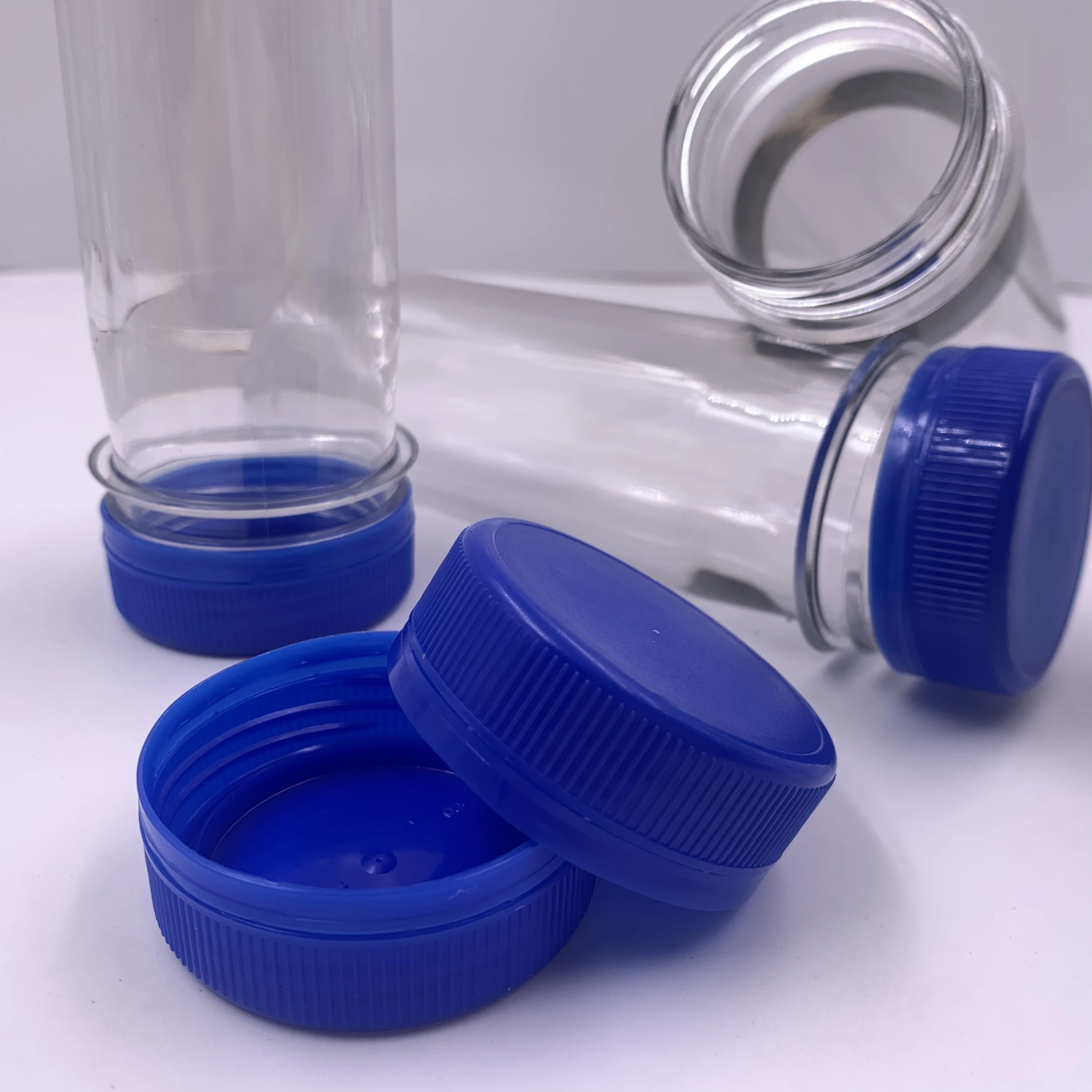 manufacturer cheap price 48mm blue plastic bottle water cap and handel  for juice oil bottle manufacture