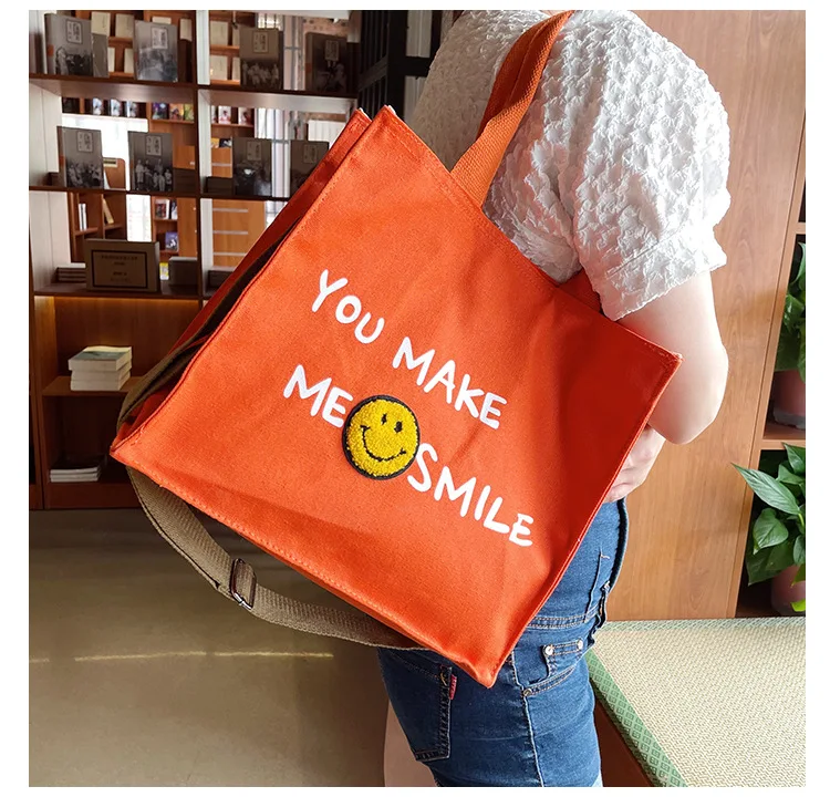Bolso lateral con estampado de cara sonriente para chicas, bandolera de  mano para estudiantes universitarios, bolsas de lona