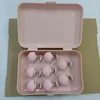 Caja de almacenamiento rosa de 8 unidades con clavos de tela y alfileres de acero.