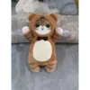 The little bear transforms into a plush cat pillow.