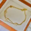 Bracciale a doppio strato in oro con quadrifoglio traforato