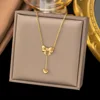 Collana in acciaio inossidabile a forma di cuore con fiocco