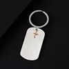 Silver key ring with rose gold cross