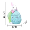 Blue Easter egg with cheek green rabbit