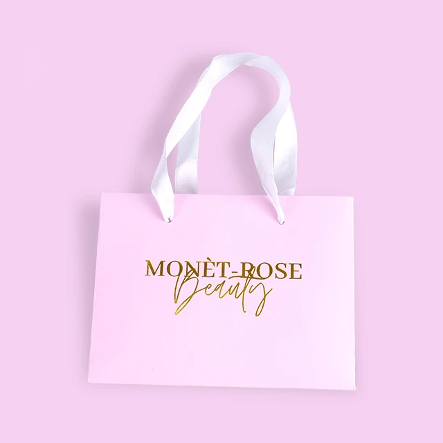 Hot sale Custom Logo Pink Cosmetic Paper Gift Bags With Gold Foil Stamping factory