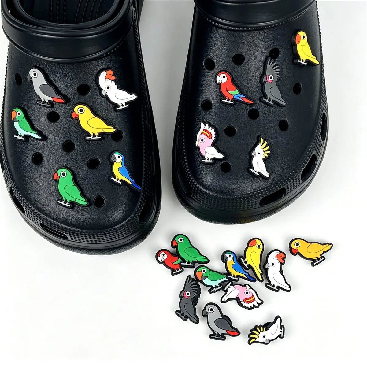 Tropical bird themed shoe charms on black clogs