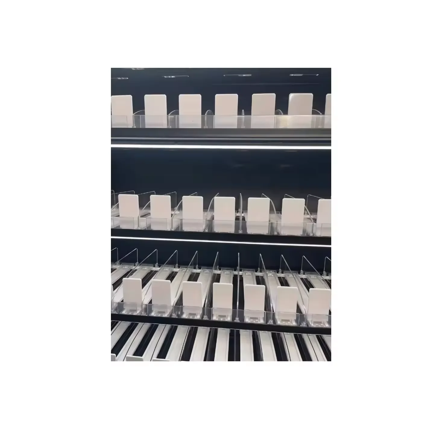 Wall Display Unit With Cigarette Pushers and Storage