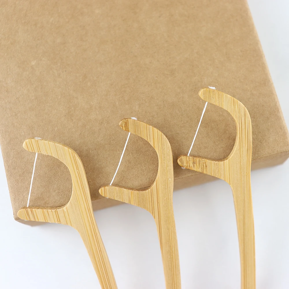 Umweltfreundliche, biologisch abbaubare Zahnseide-Sticks aus veganem Bambus  fr die Mundhygiene