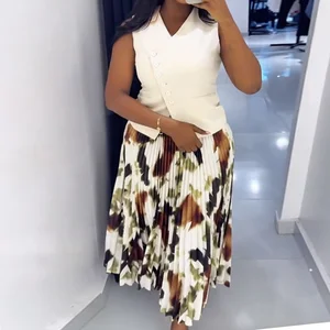 New Arrival Wholesale 2025 Women Clothes Vendor Sleeveless Irregular V-neck Tops and Printed Pleated Long Skirt 2 Piece Set