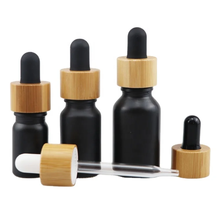 10ml 30ml 50ml cosmetic packaging essential oil dropper bottle glass bottles with wooden cap black glass bottle