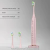 corps rose + deux têtes de brosse + chargeur sans fil