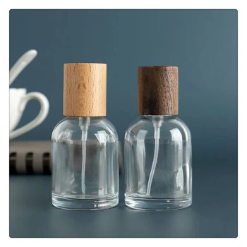 Luxury Design 30ml 50ml 100ml Sample Perfumes Bottles For Sale Small Spray Empty Glass Perfume Bottle With Pump And Wood Cap
