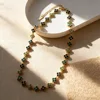 Green, black, diamond and gold