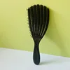 Peine negro de siete garras