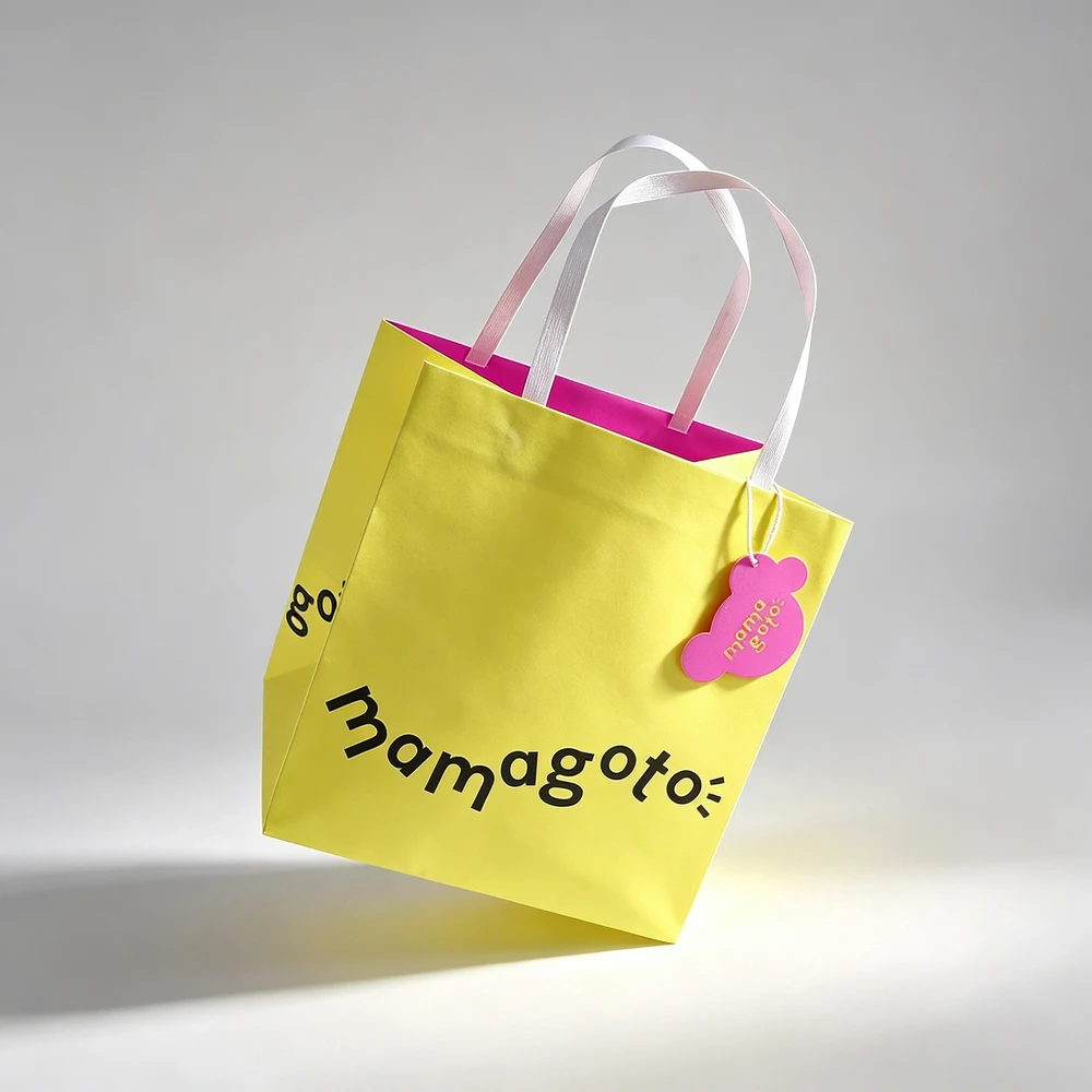 Trendy Custom Logo Offset Printing Biodegradable Coated Paper Gift Bag with Flat Handles for Fashion Store Retail