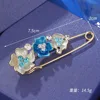 Blue flower brooch