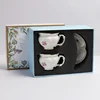 white-double cup and saucer