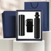 แก้วเก็บอุณหภูมิ LCD + เสื้อกันฝน + พาวเวอร์แบงค์แบบพกพา - สีดำ