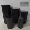 Ensemble de cinq tables à dessert cylindriques plissées noires