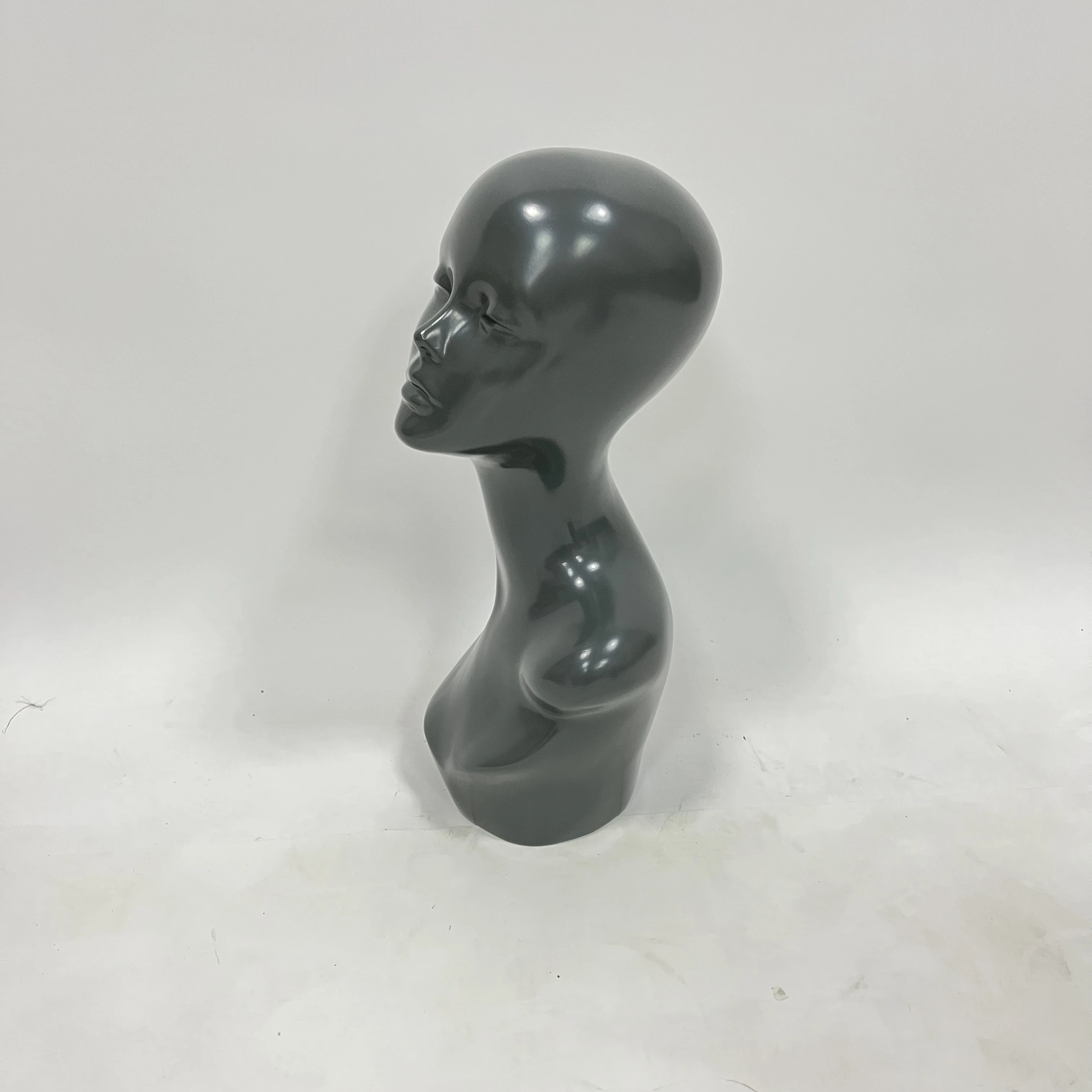 Female mannequin head in black pvc