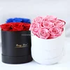 7 rose in scatola rotonda