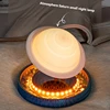 round base with levitating Saturn