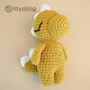Muñeco dinosaurio amarillo