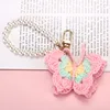 Llavero de mariposa de ganchillo rosa