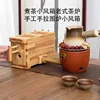 Hand-operated bellows for stove