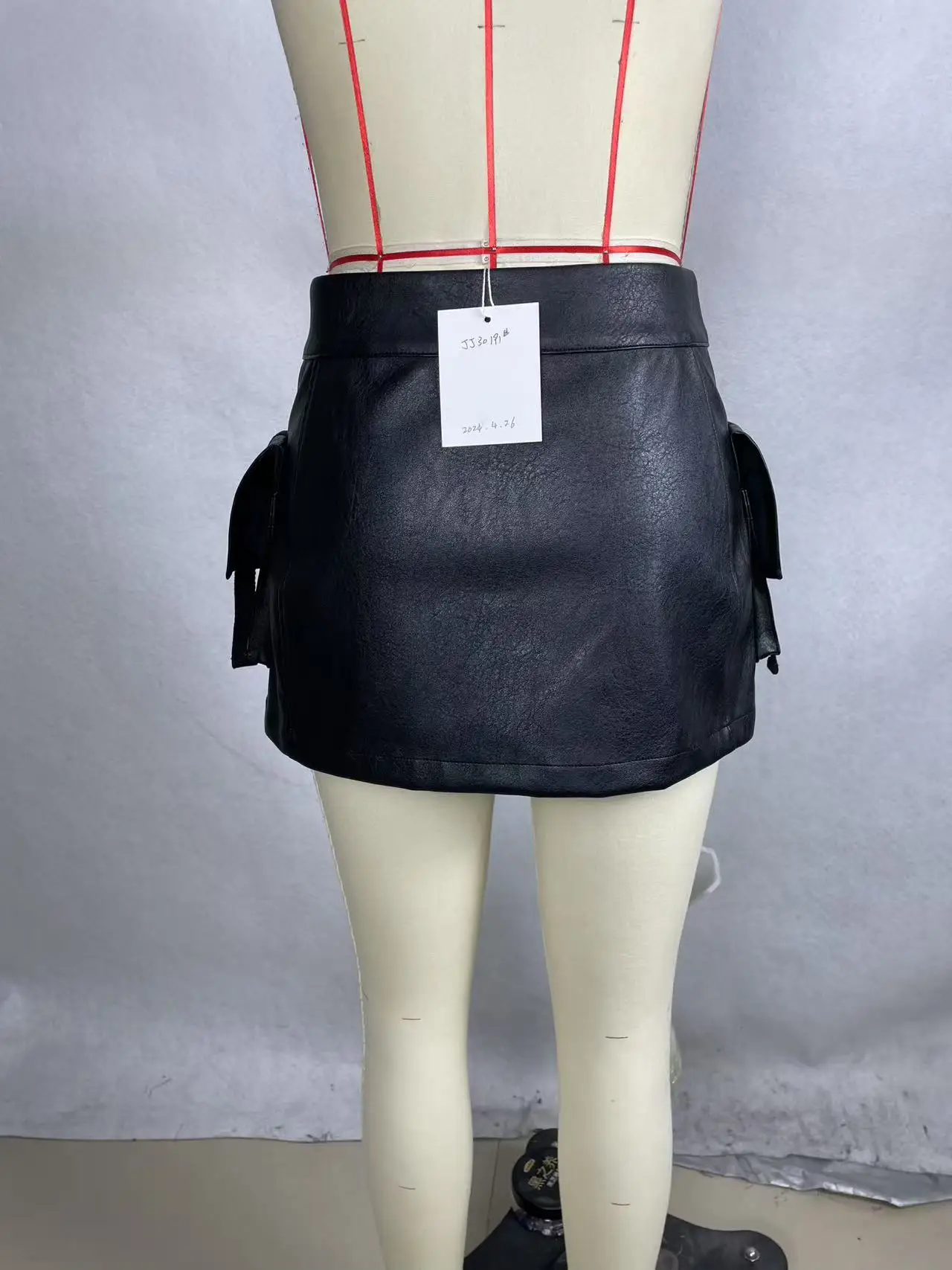 A Trendy, Cool, Short Leather Skirt With Multiple Compartments And Zippers. - Image 2