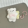 Petit ours agitant coloré