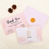 Ensemble avec enveloppe et autocollant